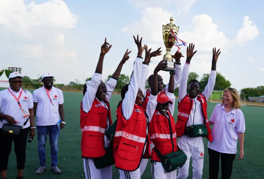 Juba Branch volunteers raising their trophy
